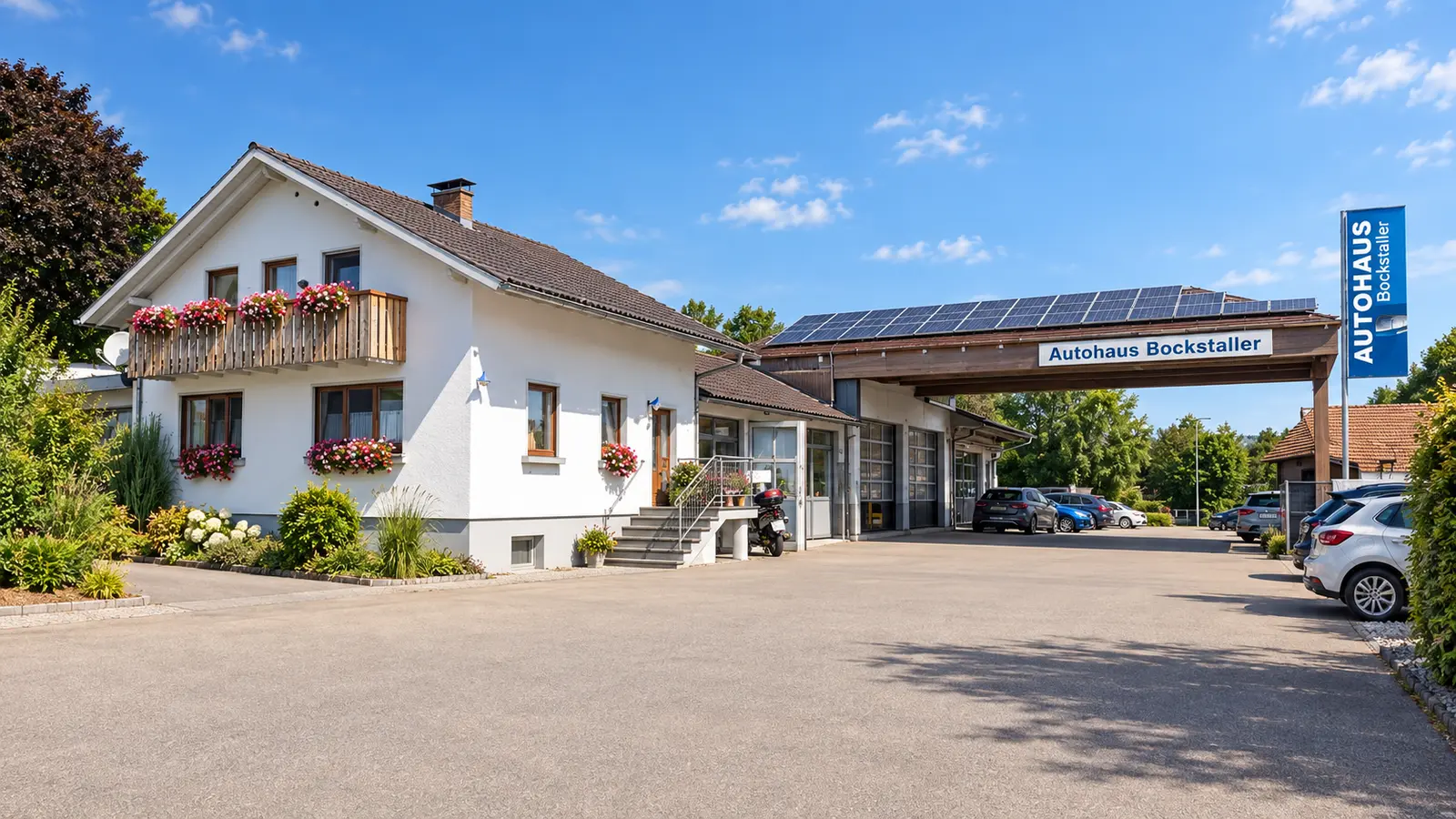 Autohaus Bockstaller in Brenden mit Werkstatt und Kundenparkplatz